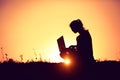 Girl with laptop on sunset Royalty Free Stock Photo