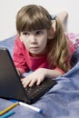Girl with laptop surfing the net