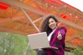 Girl laptop thumb up - caucasian woman showing blank black laptop computer screen, looking at camera smiling, gesturing Royalty Free Stock Photo