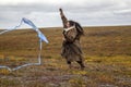 Girl launches a kite in the tundra for the first time in her life Royalty Free Stock Photo