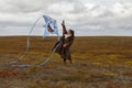 Girl launches a kite in the tundra for the first time in her life Royalty Free Stock Photo