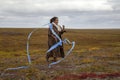 Girl launches a kite in the tundra for the first time in her life Royalty Free Stock Photo