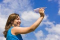 Girl launching a paper plane Royalty Free Stock Photo