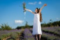 A girl in the lavender field at sunset. A girl smelling lavender flowers. Royalty Free Stock Photo