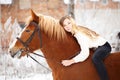 Girl laying on horse neck. Friendship background Royalty Free Stock Photo