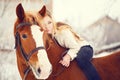 Girl laying on horse neck. Friendship background Royalty Free Stock Photo