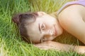 Girl laying on a meadow