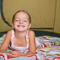 Girl laying in tent