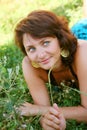 Girl lays on a grass a meadow Royalty Free Stock Photo