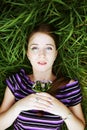 Girl lays on a grass a meadow Royalty Free Stock Photo