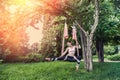 girl with lean figure type decided to practice yoga exercises in t open air in good weather.