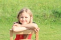 Girl leaning on chair Royalty Free Stock Photo