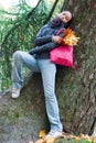 Girl leaning on tree Royalty Free Stock Photo