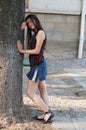Girl leaning on tree Royalty Free Stock Photo
