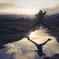 Girl Leaps Over Stream Royalty Free Stock Photo