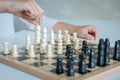 A girl learn how to play chess game