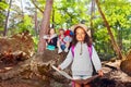 Girl learn orientation in forest on summer holiday