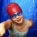 Girl learning how to swim Royalty Free Stock Photo