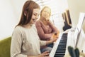 Girl learning play piano with teacher Royalty Free Stock Photo