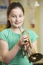 Girl Learning To Play Trumpet In School Music Lesson Royalty Free Stock Photo