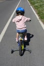 Girl learning to ride a bike
