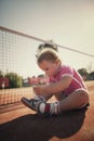 Girl learning to tie shoelaces Royalty Free Stock Photo