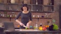 Girl learns to cook in apartment. Royalty Free Stock Photo