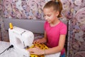 Girl learns to sew Royalty Free Stock Photo