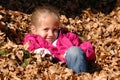 Girl in Leaves Royalty Free Stock Photo