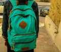 Girl leaving for school on fall morning, with bag on back Royalty Free Stock Photo