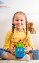 Girl with lego house Royalty Free Stock Photo