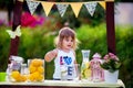 Girl at lemonade stand