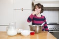 Girl Licking Batter While Preparing Cupcake