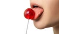 The girl licks a red round Lollipop with her tongue. Close up. Isolated on a white background