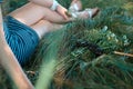 The girl lies under a tree with glasses and a bouquet of flowers. Royalty Free Stock Photo