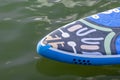 SUP board up paddle girl boarding on lake standing happy on water Royalty Free Stock Photo