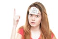 Girl with light bulb on paper on her forehead.