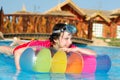 Girl on lilo in pool Royalty Free Stock Photo