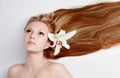 Girl with lily flower in hair Royalty Free Stock Photo