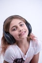 Girl listening to lovely music on headphone