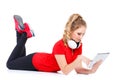 Girl listening to music on a tablet computer. Royalty Free Stock Photo