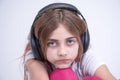 Girl listening to sad music on headphone Royalty Free Stock Photo