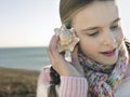 Girl Listening To Seashell On Beach Royalty Free Stock Photo