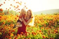 Girl and little boy or child in field of poppy Royalty Free Stock Photo