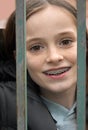 Girl locked in behind a fence Royalty Free Stock Photo