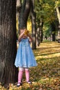 A girl with a lollipop in autumn