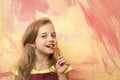 Girl with long blond hair eating red chilly pepper Royalty Free Stock Photo