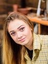 Girl with long blond straight shining hair posing indoors. Beautiful teenage model wearing boyish retro outfit. Female Royalty Free Stock Photo