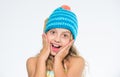 Girl long hair happy face white background. Kid wear warm soft knitted blue hat. Difference between knitting and crochet