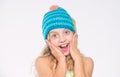 Girl long hair happy face white background. Kid wear warm soft knitted blue hat. Difference between knitting and crochet